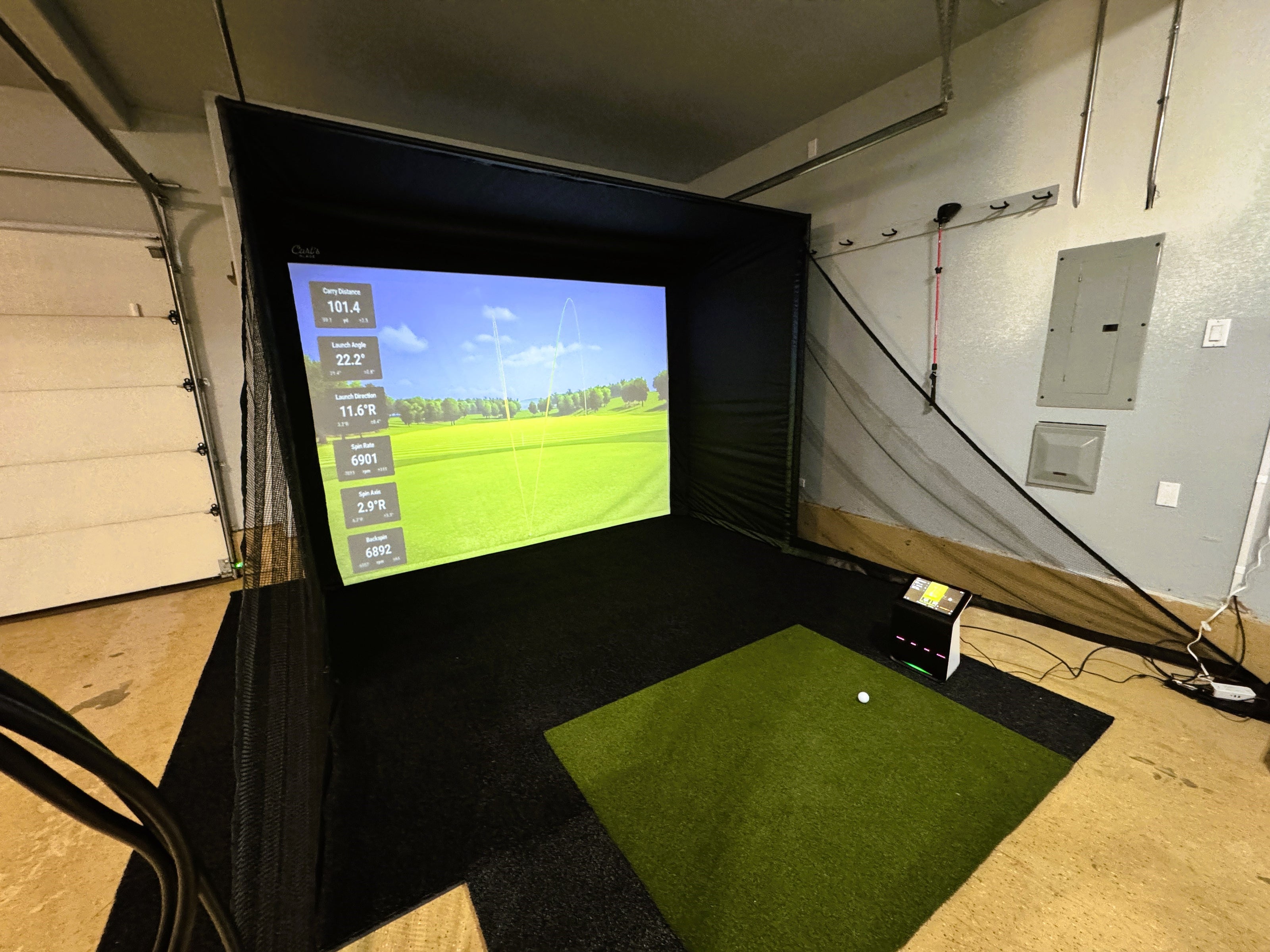 A simple garage golf simulator in West Linn featuring the Garmin R50 launch monitor.