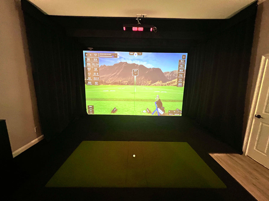 Uneekor Eye XO golf simulator installed in a basement