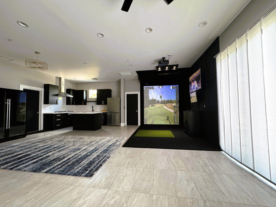 entire room view with a golf simulator