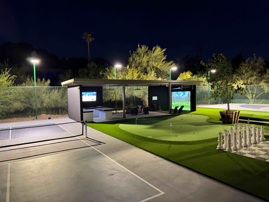 Golf simulator in a pergola at night