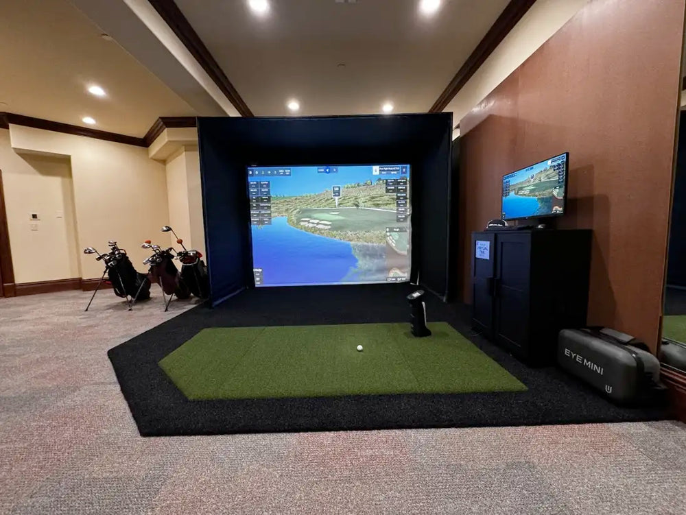 Simple and clean home golf simulator in a basement.