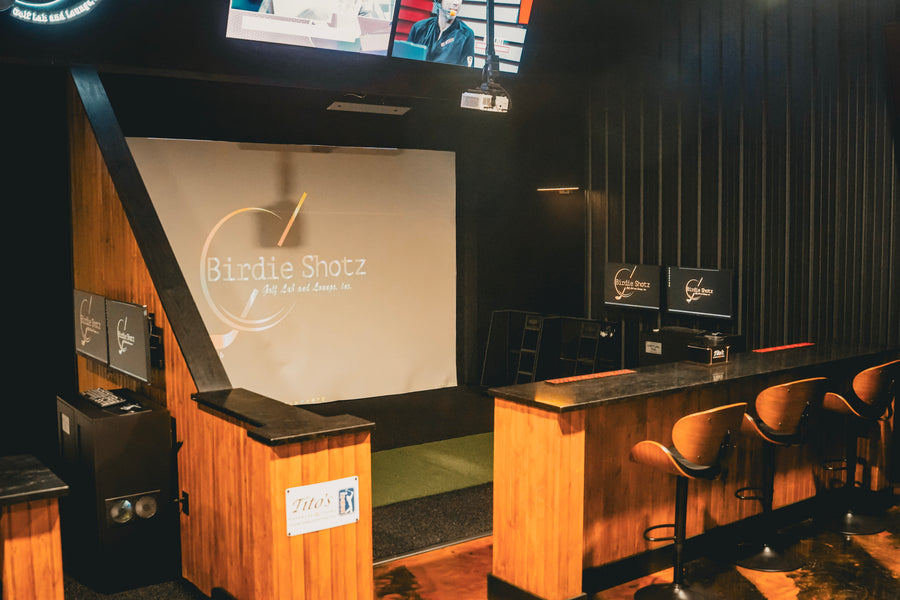 Golf Simulator Bar area with a screen displaying 'Birdie Shotz' branding