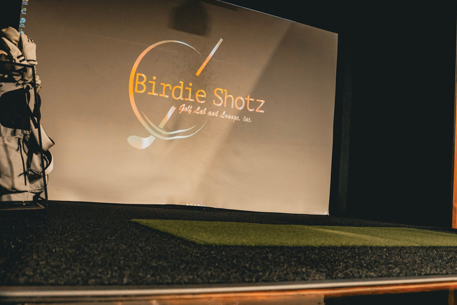 Birdie Shotz golf bag in a golf simulator bay