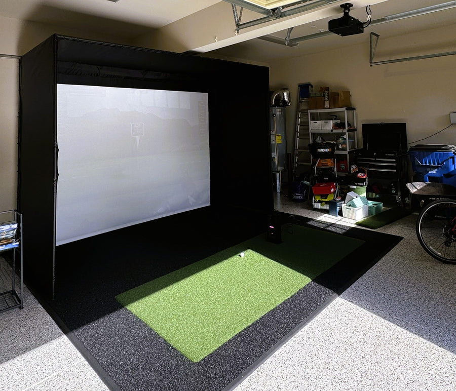 Garage with a black screen and projector setup for a home theater system.