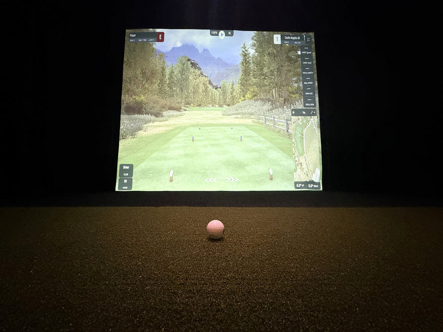 Golf simulator with a simulator screen displaying a golf course