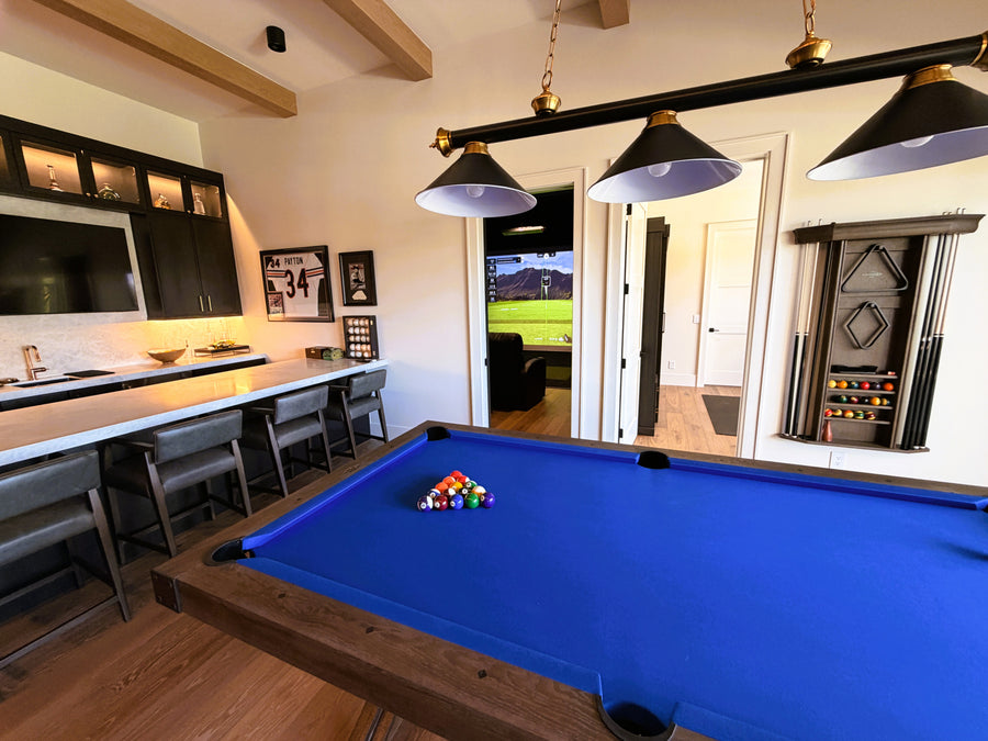 Game room with pool table, TV, and a golf simulator in the next room.