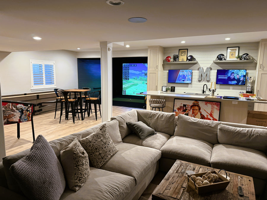Man cave with golf simulator.