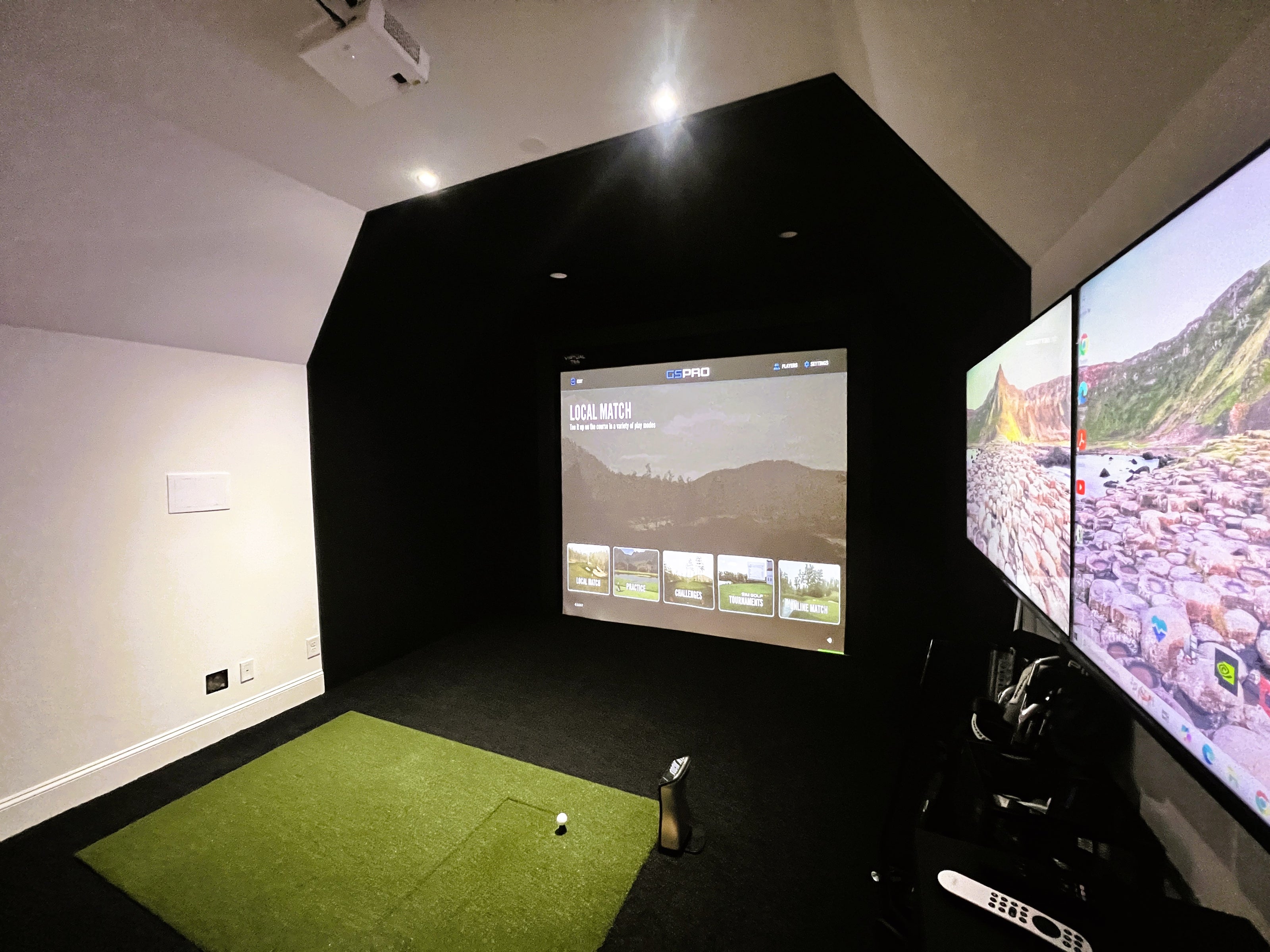 Home golf simulator with black and green turf in Charlotte, NC