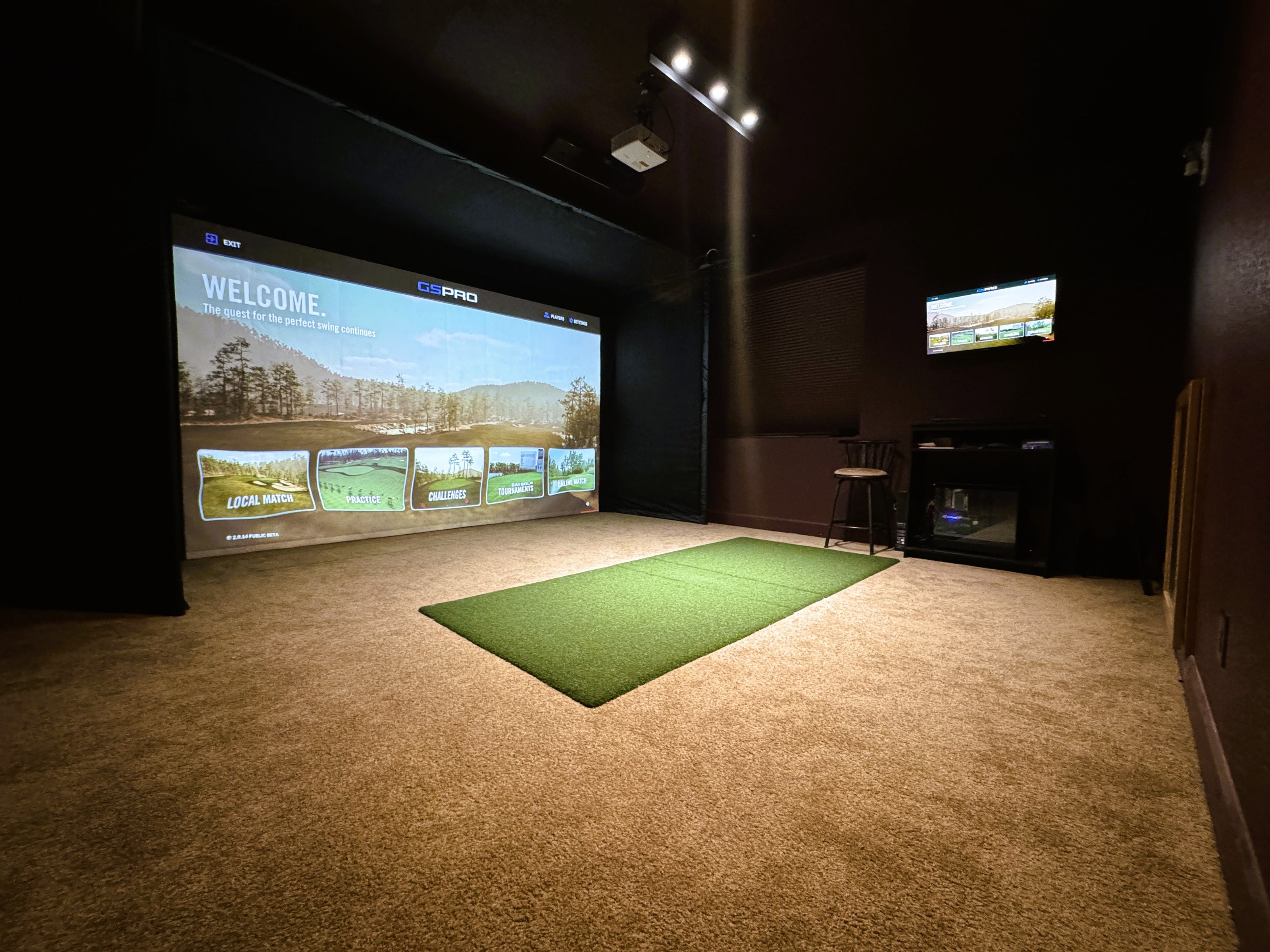 basement golf simulator with mat inset into carpet