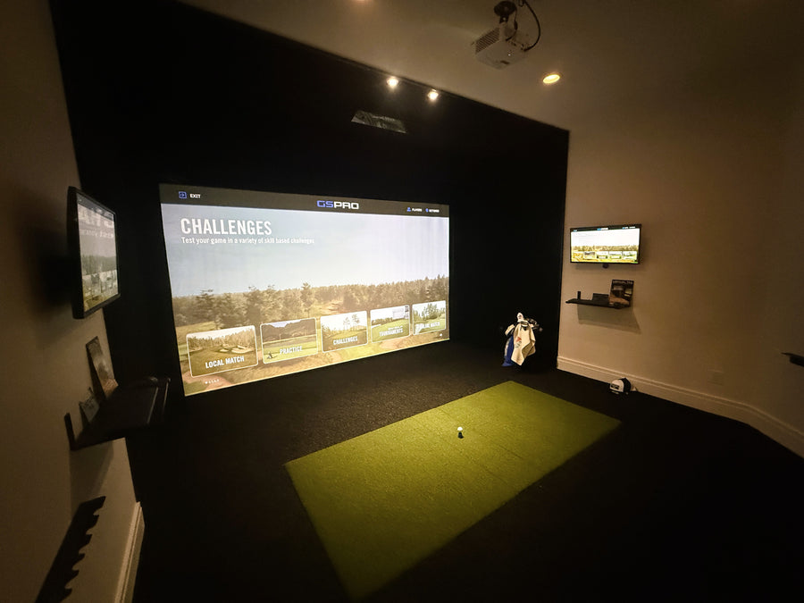 Golf simulator setup with a large screen displaying a golf course.