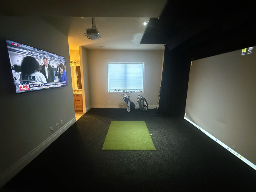Indoor golf simulator in spare bedroom.