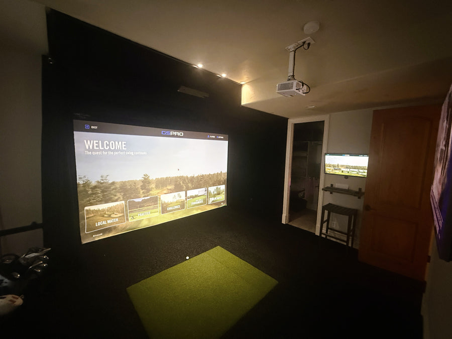 Indoor golf simulator in spare bedroom.