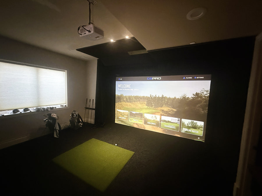 Indoor golf simulator in spare bedroom.