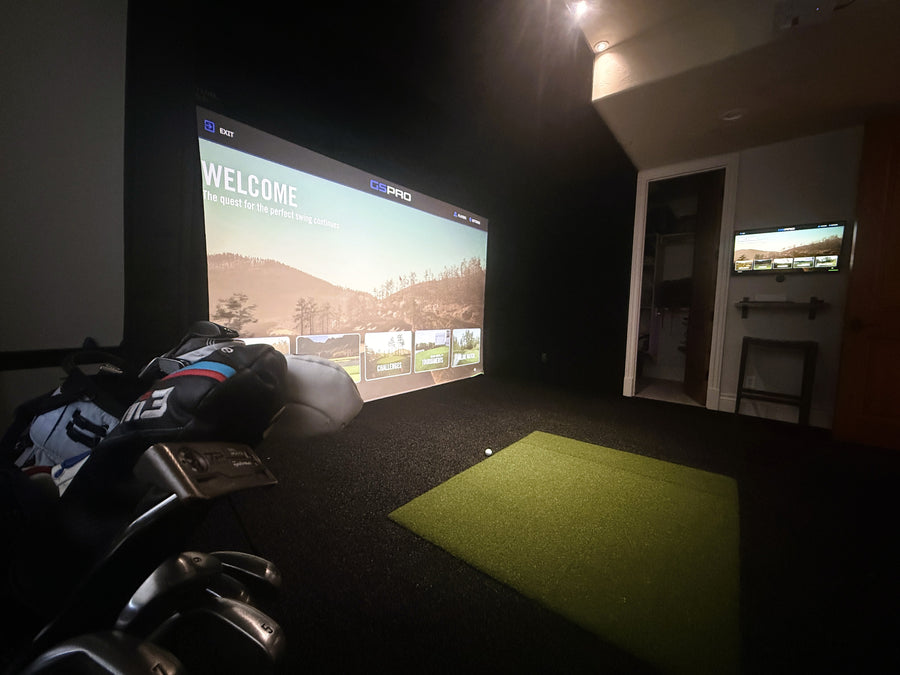 Indoor golf simulator in spare bedroom.