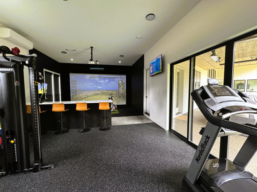 home gym with a golf simulator