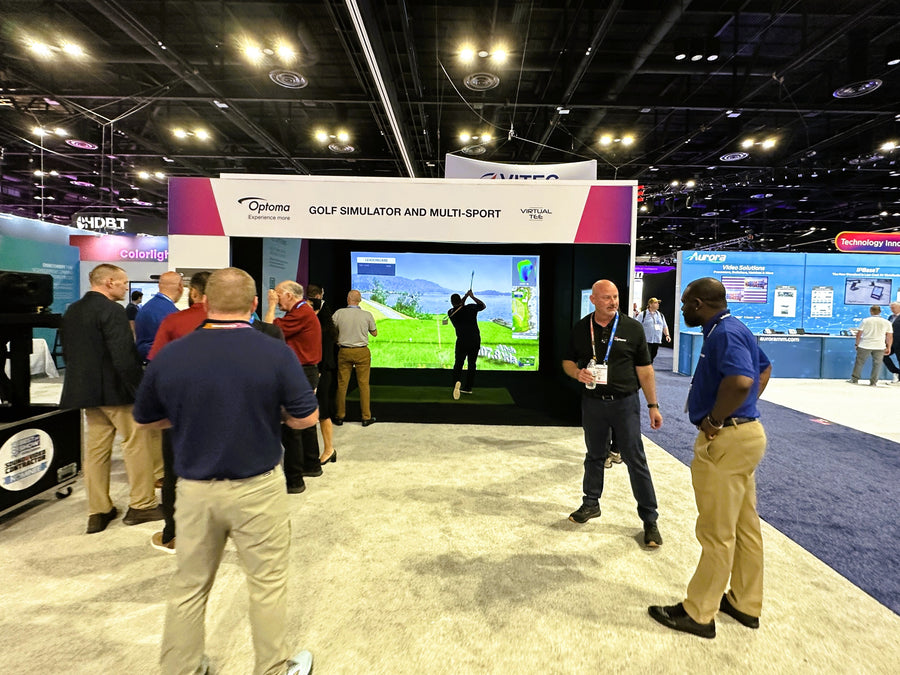 a golfer hits in a golf simulator at Infocomm