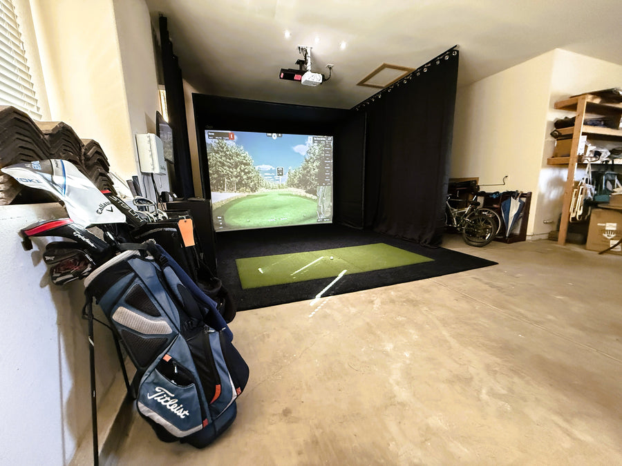 Golf simulator with a cage setup  in a garage.