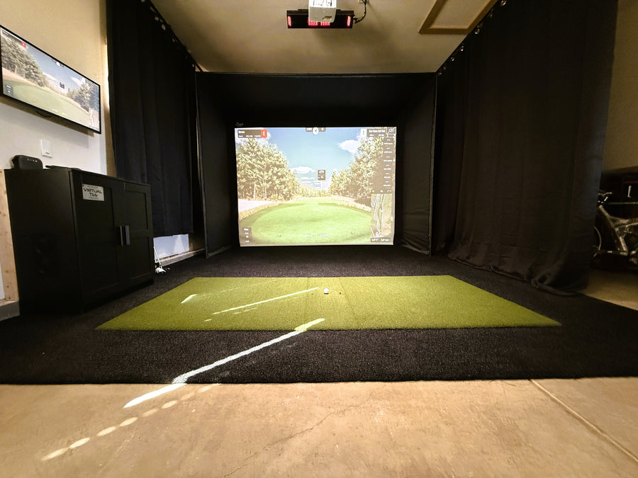 Uneekor EYE XO in a garage golf simulator