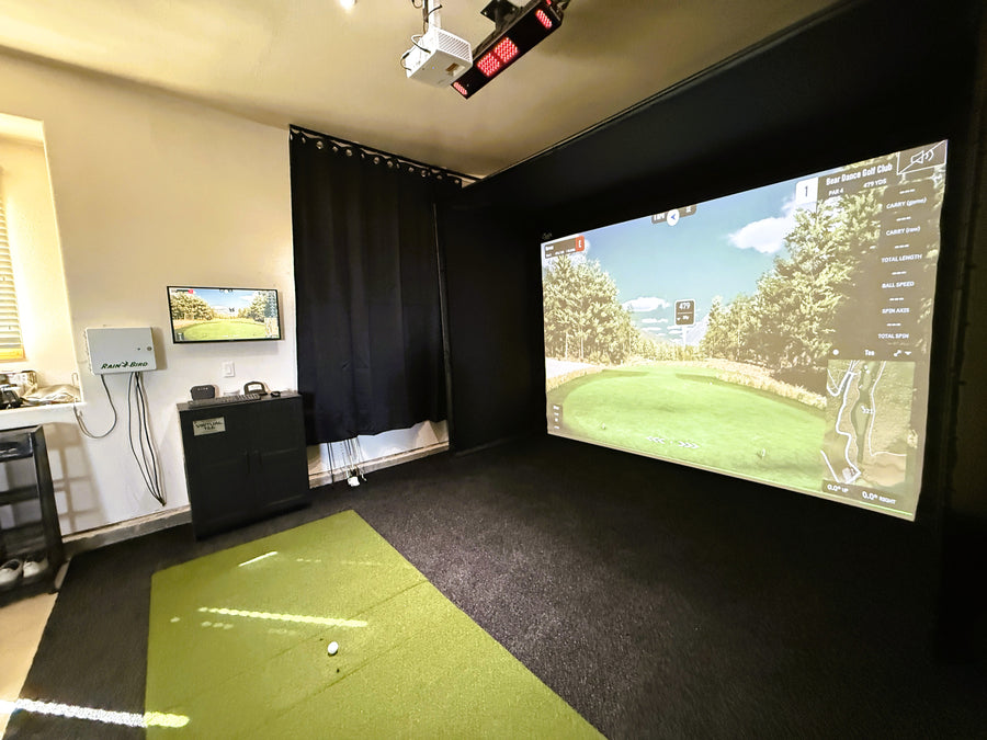 Optoma projector in a garage golf simulator setup