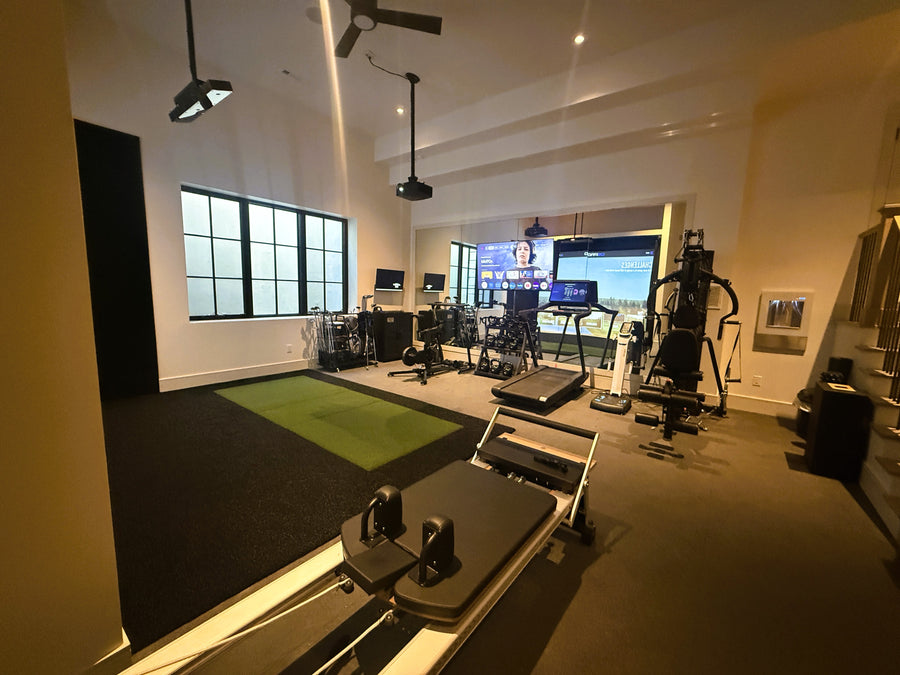 Gym interior with exercise equipment including treadmills and weight machines.