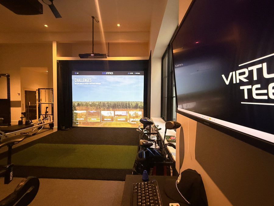 Golf simulator setup with screen displaying virtual golf game and 'Virtuoso' branding.