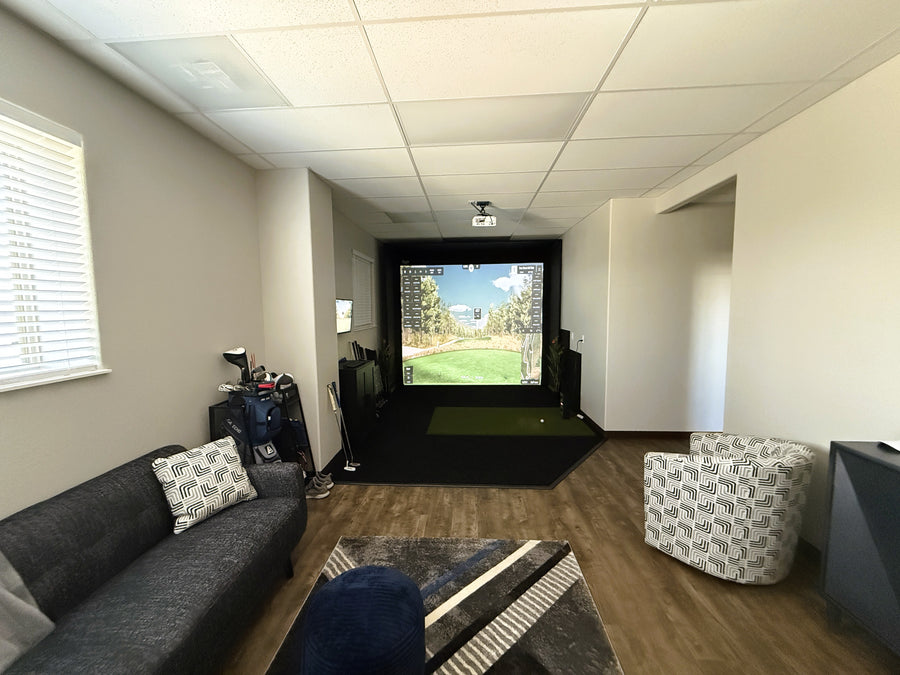 Office with a golf simulator setup