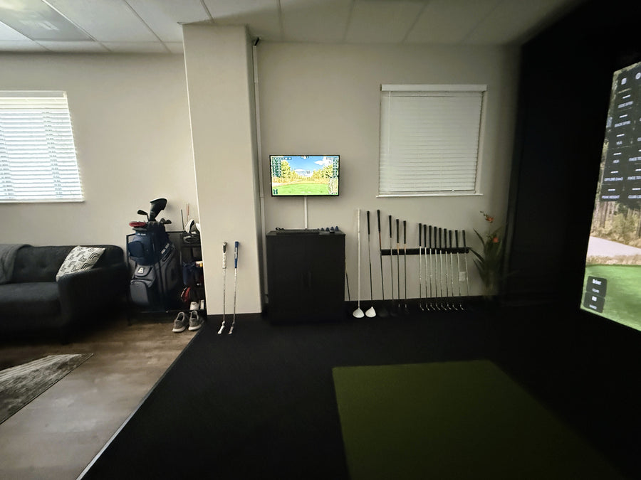 Living room with a television displaying a sports game, surrounded by furniture and decor.