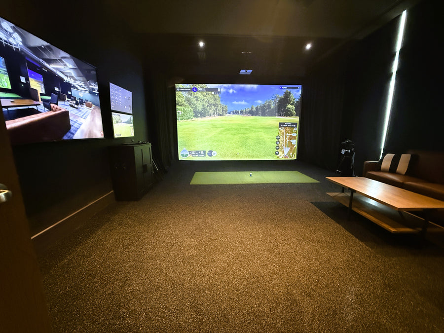 Golf Simulator room with multiple screens displaying different scenes.