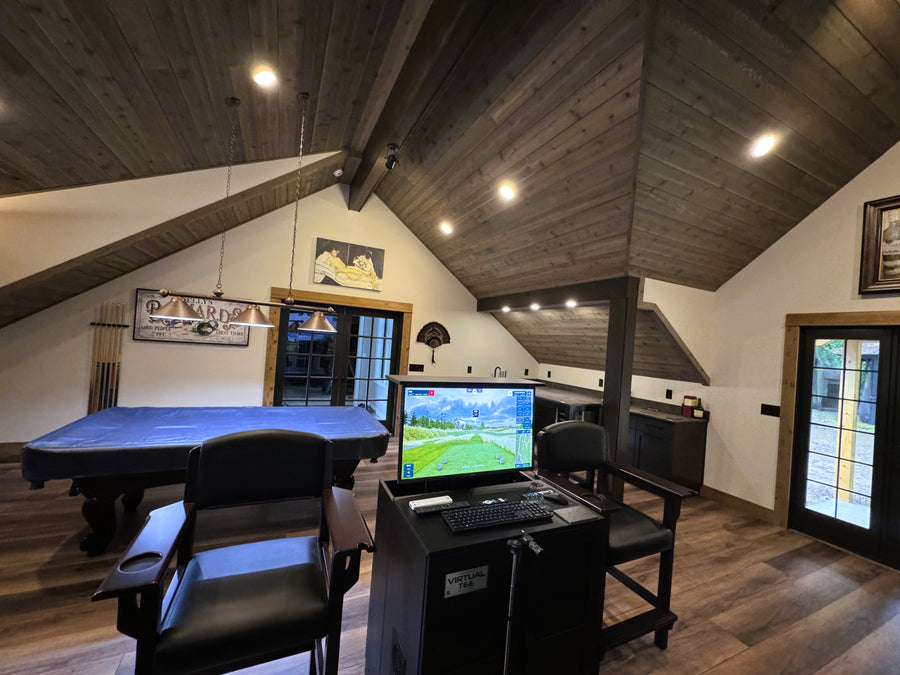 Game room with pool table, TV, and gaming console.