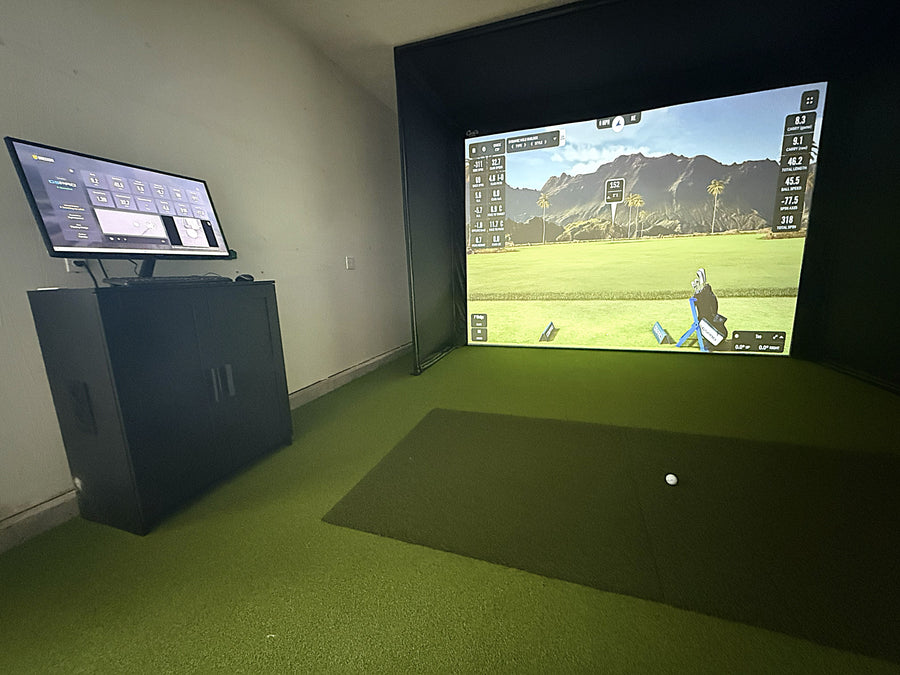 Indoor golf simulator in a garage space