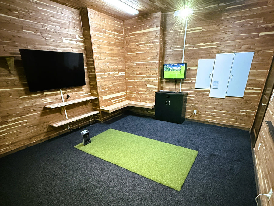 Home golf simulator with wood paneling