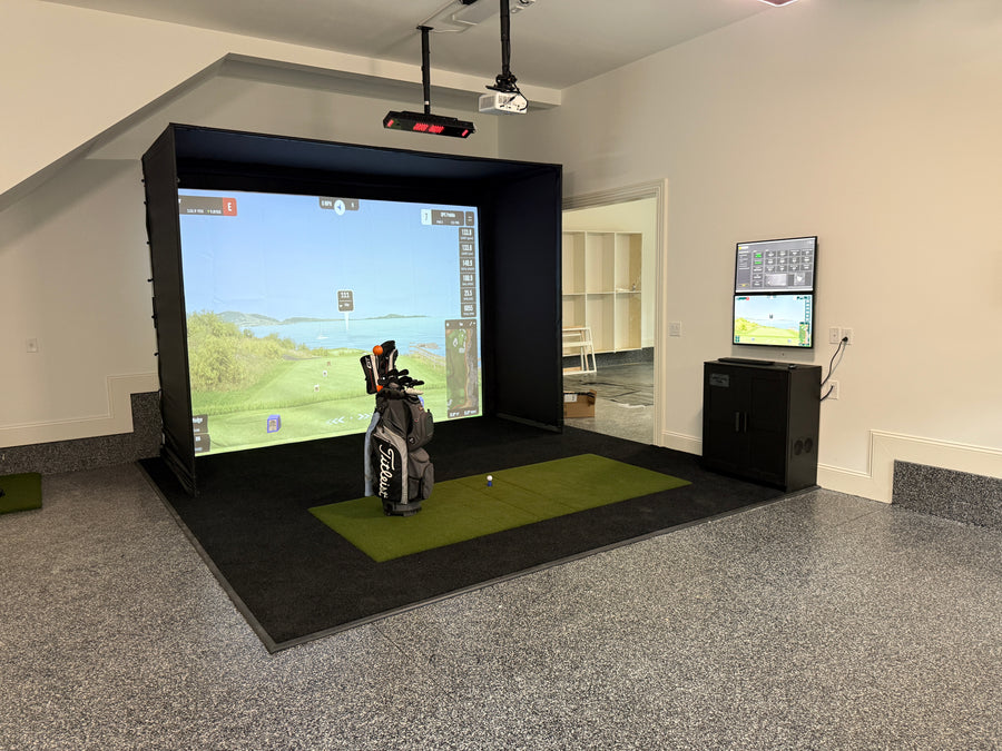 Golf simulator setup in a garage.