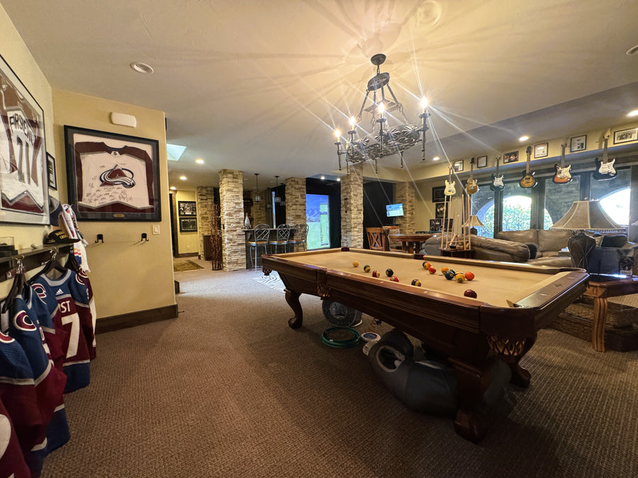 Game room with pool table, golf simulator and sports memorabilia on the walls