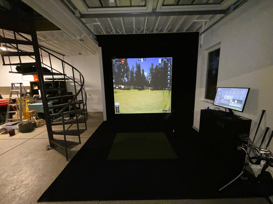 Garage golf simulator setup displaying a round of golf