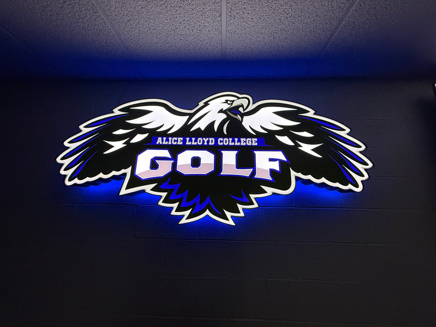 Alice Lloyd College Golf sign illuminated on wall. 