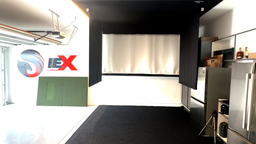 Garage retractable golf simulator